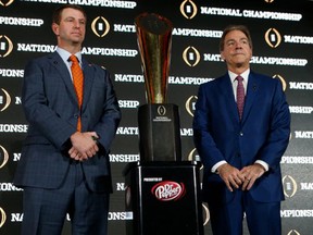 Head coach Dabo Swinney of the Clemson Tigers, left, and head coach Nick Saban of the Alabama Crimson Tide pose for a photograph after speaking to members of the media during the College Football Playoff National Championship Head Coaches Press Conference on January 8, 2017 at the Tampa Convention Center in Tampa, Florida. (Brian Blanco/Getty Images)