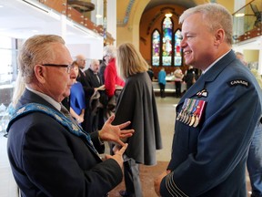 LUKE HENDRY/THE INTELLIGENCER
Prince Edward County Mayor Robert Quaiff talks with Col. Colin Keiver, who commands CFB Trenton, at Quaiff's annual New Year's levee at the Macaulay church in Picton last year. This year's levee for County council will be held Sunday.