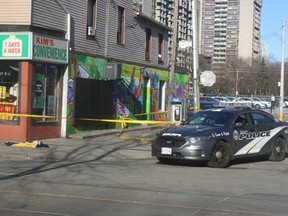 A police cruiser is pictured in the Queen-Sherbourne Sts. area where a man was shot and killed. (TERRY DAVIDSON, Toronto Sun)