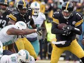Pittsburgh Steelers quarterback Ben Roethlisberger is pressured by Miami Dolphins defensive end Andre Branch as he scrambles out of the pocket during the second half of an AFC wild-card NFL football game in Pittsburgh, Sunday, Jan. 8, 2017. (AP Photo/Fred Vuich)