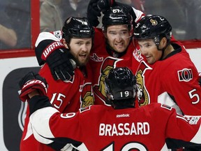 Ottawa Senators Zack Smith celebrates his goal against the Edmonton Oilers with teammates Mark Stone Cody Ceci and Derick Brassard during first period NHL hockey action in Ottawa on Sunday, January 8, 2017. (THE CANADIAN PRESS/Fred Chartrand)