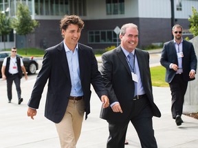 Nathan Denette/ THE CANADIAN PRESS
Prime Minister Justin Trudeau, left, arrives and is greeted by Laurentian University President Dominic Giroux at the Liberal cabinet retreat on Sunday.