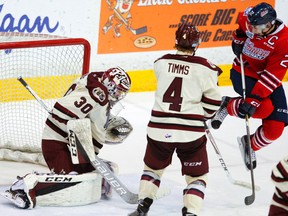 Petes goalie Dylan Wells makes a glove save next to Oshawa Generals' Anthony Cirelli as defenceman Matthew Timms moves in during OHL action Nov. 22, 2016, in Peterborough. The Generals traded Cirelli to the Erie Otters on Monday. (Clifford Skarstedt/Postmedia Network)