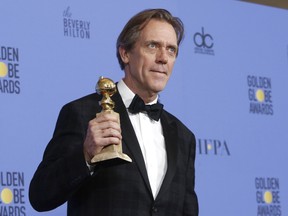 Hugh Laurie with his award for Best Performance by an Actor in a Supporting Role in a Series, Limited Series, or Motion Picture Made for Television, at the 74th Golden Globe Awards this past Sunday. (WENN.com)