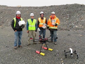 A crew from Hatch shows off some of the drone equipment used for water sampling in pit lakes. (Photo supplied)