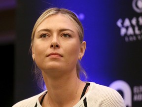 In this Monday, Oct. 10, 2016 file photo, Maria Sharapova speaks to members of the media prior to a World Team Tennis exhibition in Las Vegas. Sharapova will return from her 15-month doping ban at a tournament in Germany in April. (AP Photo/Isaac Brekken, file)