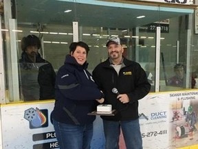 Lorrie O'connor receives her Volunteer of the Month certificate and gift from Mayor Peter Politis in December.