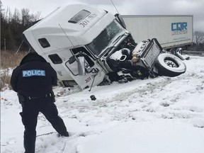 The westbound lanes of Hwy. 401 were shut down near Brighton, Ont., after a tractor-trailer jackknifed Monday. (Pete Fisher/Northumberland Today/Postmedia Network)