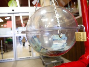 Donations are seen inside a Salvation Army collection kettle at the entrance to a Sobeys grocery store in London, Ont. on Tuesday December 6, 2016. (Free Press file photo)