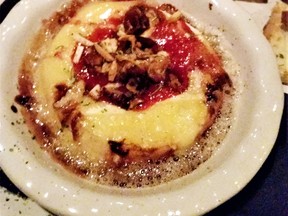 Almanac’s delicious baked brie adorned with cranberry, pear and walnut.