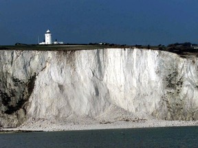 This is a Thursday, Feb. 1, 2001. file photo shows the lighthouse on top of the White Cliffs of Dover, England. (AP Photo/Dave Caulkin, File)