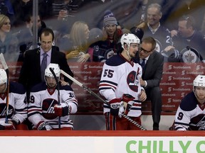 Winnipeg Jets centre Mark Scheifele listens to head coach Paul Maurice while playing against the Calgary Flames during Monday night's game. (THE CANADIAN PRESS/Trevor Hagan)