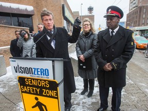 Toronto Mayor John Tory, joined by Coun. Jaye Robinson and Toronto Police Chief Mark Saunders, addresses the media on Dundas St. W. at Bloor St. W. Toronto, on Tuesday January 10, 2017. They talked about the City's road safety plan. (Ernest Doroszuk/Toronto Sun)