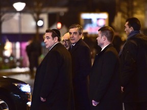 French Jewish central Consistory President Joel Mergui (L) and former French Prime Minister Francois Fillon (C), the rightwing Republican party candidate for the French 2017 presidential election, leave after a ceremony marking the second anniversary of the deadly attack against the Hyper Cacher supermarket in Paris on January 9, 2017. (CHRISTOPHE ARCHAMBAULT/AFP/Getty Images)