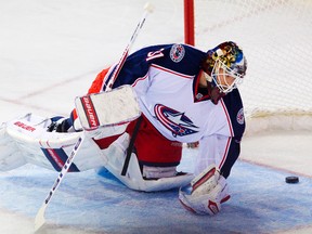 Columbus Blue Jackets goalie Curtis McElhinney looks on after letting in a goal against the Edmonton Oilers on Nov. 19, 2013. (Amber Bracken/Edmonton Sun)