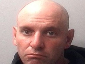 Michael Ross Burnett, seen here in this Kingston Police handout photo, is accused of unlawful confinement and sexual assault causing bodily harm in the attack of a woman on Wolfe Island in 2015.