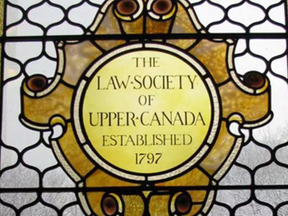 The Law Society of Upper Canada says Ottawa lawyer Ronald Houlahan never told it about criminal charges he is facing as he is required to do under law society bylaws.