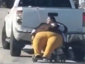 A Kansas City pastor was criticized online after he posted a video of Becky Kittrell being dragged behind a pickup truck after her wheelchair got stuck in the snow. (YouTube screengrab)