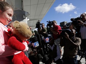 Courtney Gelinas talks with the news media after being reunited with her bear Rufus, at the Fort Lauderdale-Hollywood International Airport, Tuesday, Jan. 10, 2017, in Fort Lauderdale, Fla.  (AP Photo/Lynne Sladky)