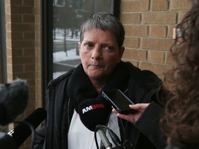 Louise Martens, a leader among diluted chemo drug victims fighting a proposed class-action lawsuit settlement, speaks to reporters outside court in Windsor Tuesday.  (JASON KRYK/WINDSOR STAR/POSTMEDIA NETWORK)