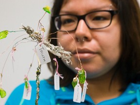 Joleen Kechego shows the Tree of Life sculpture she made with the Positive Voice program at Nokee Kwe in London. (MIKE HENSEN, The London Free Press)