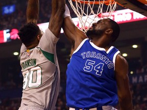 Raptors’ Patrick Patterson blocks the Celtics’ Amir Johnson at the Air Canada Centre Tuesday night. (Dave Abel/Toronto Sun)
