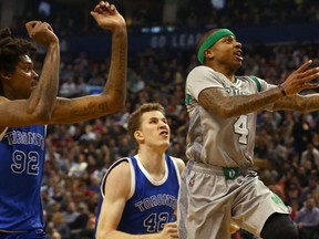 Jakob Poeltl of the Toronto Raptors chases Isaiah Thomas of the Boston Celtics at the Air Canada Centre in Toronto, Ont. (Dave Abel/Toronto Sun/Postmedia Network)