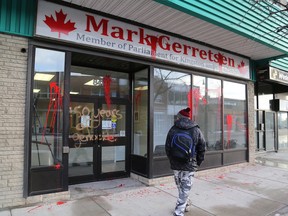 Vandals splatter paint on the glass and wrote '150 years of Genocide' on the front doors of Kingston and the Islands Member of Parliament Mark Gerretsen's constituency office on Tuesday January 11 2017. The vandalism could be in protest against Canada's first Prime Minister Sir John A Macdonald's treatment of aboriginal people. Tuesday marked the 202nd anniversary of his birth. Ian MacAlpine /The Whig-Standard