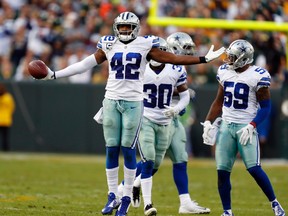 In this Oct. 16, 2016, file photo, Dallas Cowboys' Barry Church celebrates his interception during the second half of an NFL football game against the Green Bay Packers in Green Bay, Wis. (AP Photo/Matt Ludtke, File)