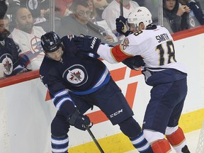 Winnipeg Jets defenceman Jacob Trouba (left) is a gametime decision Wednesday night. (Brian Donogh/Winnipeg Sun file photo)