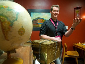 Chris Costello, of Exodus London Escape Rooms, shows off artifacts in his escape rooms in London. Costello says classroom field trips have become a staple of the business and teachers want ?interactive programs for their students . . . and this gives them a safe, fun environment to use their skills.? (MIKE HENSEN, The London Free Press)