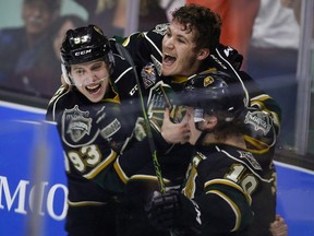 London Knights' Matthew Tkachuk, centre, celebrate the game-winning goal in the team's overtime victory in CHL Memorial Cup championship game hockey action against the Rouyn-Noranda Huskies in Red Deer, Sunday, May 29, 2016. (THE CANADIAN PRESS)
