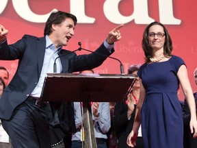 Then-Liberal leader Justin Trudeau and president Anna Gainey take the stage at the party's Biennial convention in this February 22, 2014 file photo taken in Montreal. (THE CANADIAN PRESS/Ryan Remiorz)