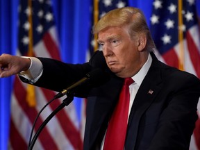 U.S. President-elect Donald Trump calls on a reporter during a press conference January 11, 2017 at Trump Tower in New York. (TIMOTHY A. CLARY/AFP/Getty Images)