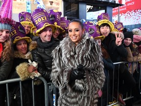 Melanie 'Mel B' Brown poses with fans during the New Year's Eve celebrations in Times Square on December 31, 2016. (ANGELA WEISS/AFP/Getty Images)