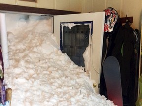 This Tuesday, Jan. 10, 2017 photo provided by Steven and Melissa Siig shows where snow has cascaded through a door of their home after one of several avalanches, some triggered by authorities, hit Alpine Meadows, Calif., in the north Lake Tahoe area. Officials said there was no major damage and no one was hurt. Several ski resorts in parts of the Sierra Nevada planned to stay shuttered Wednesday, including Squaw Valley and Alpine Meadows, which had no power because of the storm. (Steven and Melissa Siig via AP)