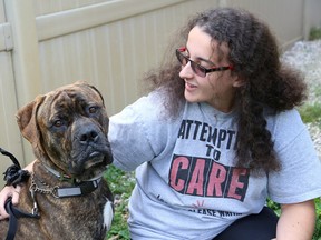 John Lappa/Sudbury Star
Dogsitter and Pet Save volunteer Rebecca Fox takes care of Mickey the dog in Sudbury on Thursday.