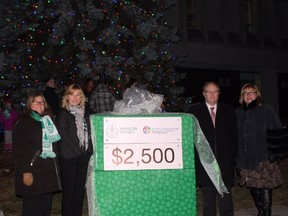 Huntington University donated $2,500 to Child & Community Resources. The money came from the university’s annual Christmas Tree lighting campaign. Mary-Liz Warwick, left, Huntington University board chair, Sherry Fournier, executive director of Child & Community Resources, Kevin McCormick, Huntington University president and vice-chancellor, and Patricia Mills, Huntington University chancellor, were on hand for the cheque presentation. Supplied photo