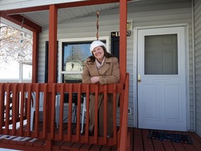 In this undated photo provided by Kodi Bryant, Bryant stands on the front porch of her trailer home in Golden, Colo. (Nathan Shafer/Kodi Bryant via AP)