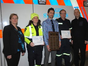 At a ceremony Wednesday in St. Thomas, paramedics Jill Foster, second from left, and Jim Sinclair, second from right, were honoured as Medical Directors Award of Excellence recipients for 2016. The awards are presented by London Health Sciences Centre (LHSC) through their Southwest Ontario Regional Base Hospital Program. On hand for the presentation, Pauline Meunier, Elgin St. Thomas EMS general manager, left; Matthew Davis, LHSC local medical director, centre; and Michael Lewell, LHSC regional medical director, right.