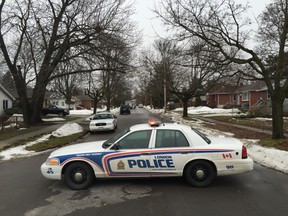 A large police presence rolled onto Emerson Avenue in London on Thursday, blocking off Emerson and Helena avenues. Six people were arrested Thursday morning in connection with two bank robberies on Wednesday night. (DEREK RUTTAN, The London Free Press)