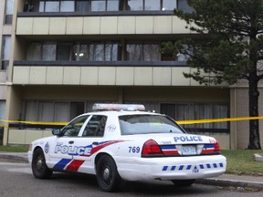 A badly injured 12-year-old boy was found on the ground outside a North York highrise after a suspected fall from a sixth-floor balcony early Thursday, Jan. 12, 2017. Toronto Police cordoned off the area where the child was found and a blue tarp can be seen on the balcony of his family's apartment. (CHRIS DOUCETTE/TORONTO SUN)
