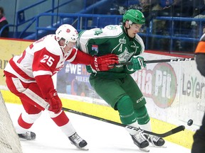 Sudbury Wolves Aiden Jamieson and Soo Greyhounds Otto Makinen battle for the puck during OHL action at the Sudbury Community Arena in Sudbury, Ont. on Wednesday January 11, 2017. Gino Donato/Sudbury Star/Postmedia Network