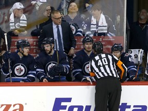 Head coach Paul Maurice talks to a referee during a break in action against the Montreal Canadiens during Wednesday night's game. (Photo by Jason Halstead/Getty Images)