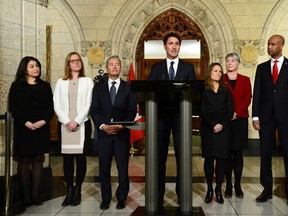Prime Minister Justin Trudeau, middle, holds a press conference as he's joined by his newly sworn in ministers Maryam Monsef, Minister of Status of Women, left to right, Karina Gould, Minister of Democratic Institutions, Francois-Philippe Champagne, Minister of International Trade, Chrystia Freeland Minister of Foreign Affairs, Patty Hajdu Minister of Labour and Ahmed Hussen Minister of Immigration, Refugees and Citizenship on Parliament Hill in Ottawa on Tuesday, Jan 10, 2017., following a cabinet shuffle at Rideau Hall. (THE CANADIAN PRESS/Sean Kilpatrick)