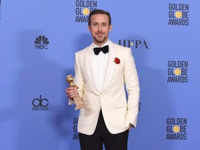 Ryan Gosling poses in the press room with the award for best performance by an actor in a motion picture - musical or comedy for "La La Land" at the 74th annual Golden Globe Awards at the Beverly Hilton Hotel on Sunday, Jan. 8, 2017, in Beverly Hills, Calif. (THE CANADIAN PRESS/AP-Photo by Jordan Strauss/Invision/AP)