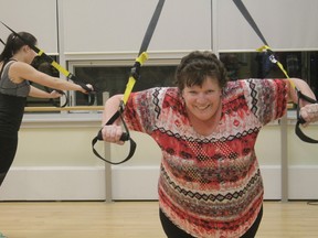 Cheryl Paris participates in the TRX Total Body workout during the Allan and Jean Millar Centre’s Flirt with Fitness event on Jan. 4 (Joseph Quigley | Whitecourt Star).