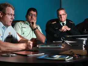 Director of Mental Health Colonel Scott McLeod, Senior Pychiatrist Colonel Rakesh Jetly and Deputy Surgeon General Colonel Colin Mackay on Dec. 18, 2013. Bruno Schlumberger/Postmedia Network