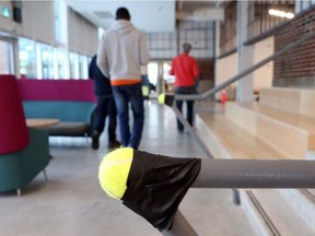 The guardrails on the stairs in our brand new "Innovation Centre" are using tennis balls on the end for safety. JEAN LEVAC /POSTMEDIA NEWS