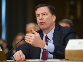 In this Jan. 10, 2017 file photo, FBI Director James Comey testifies on Capitol Hill in Washington. Justice Department's Inspector General Michael Horowitz says he will launch an investigation into the Justice Department and FBI's actions in the months leading up to the 2016 election, including whether department policies were followed by FBI Director James Comey. (AP Photo/Cliff Owen, File)
